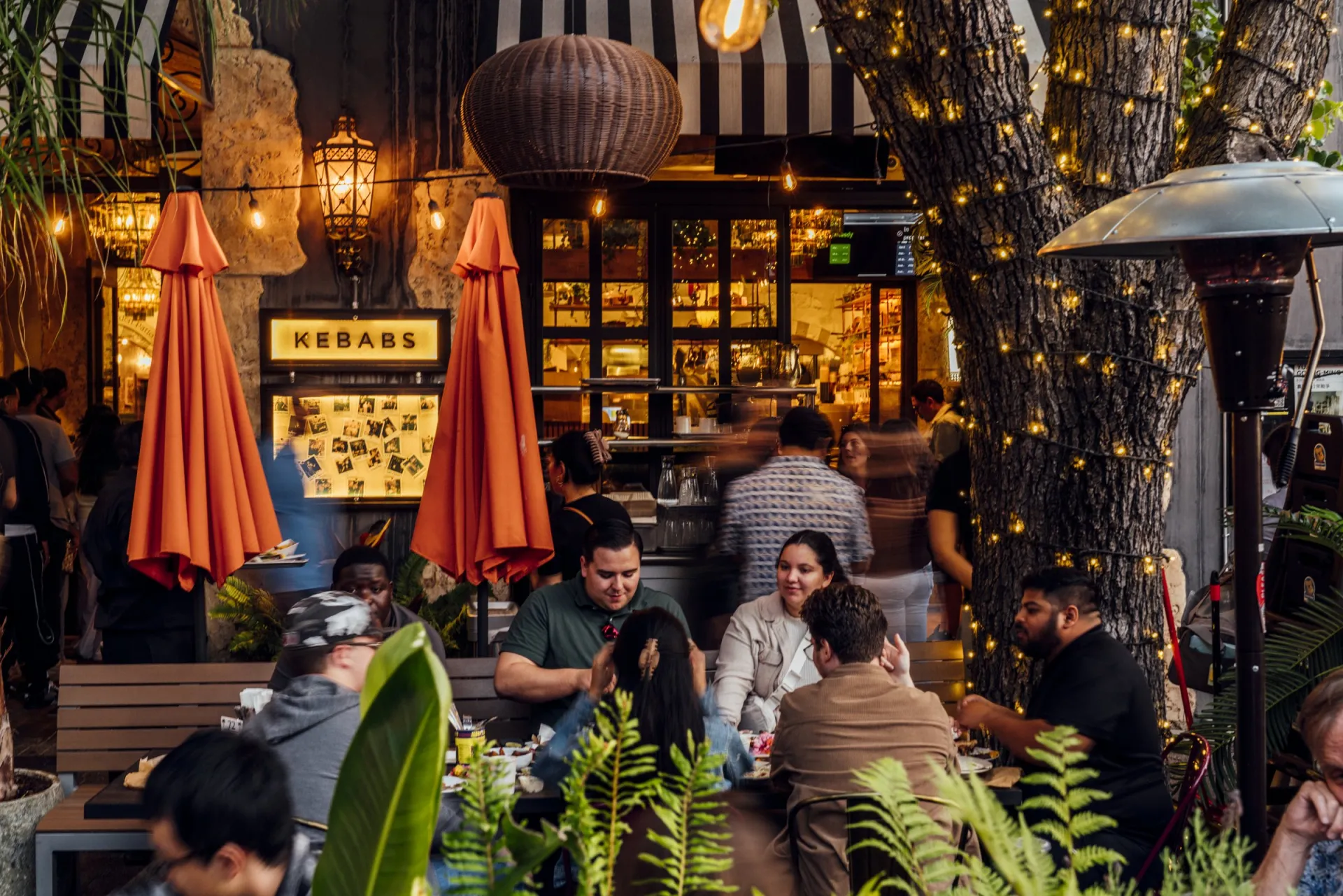 Guests on the Mazra patio in the evening